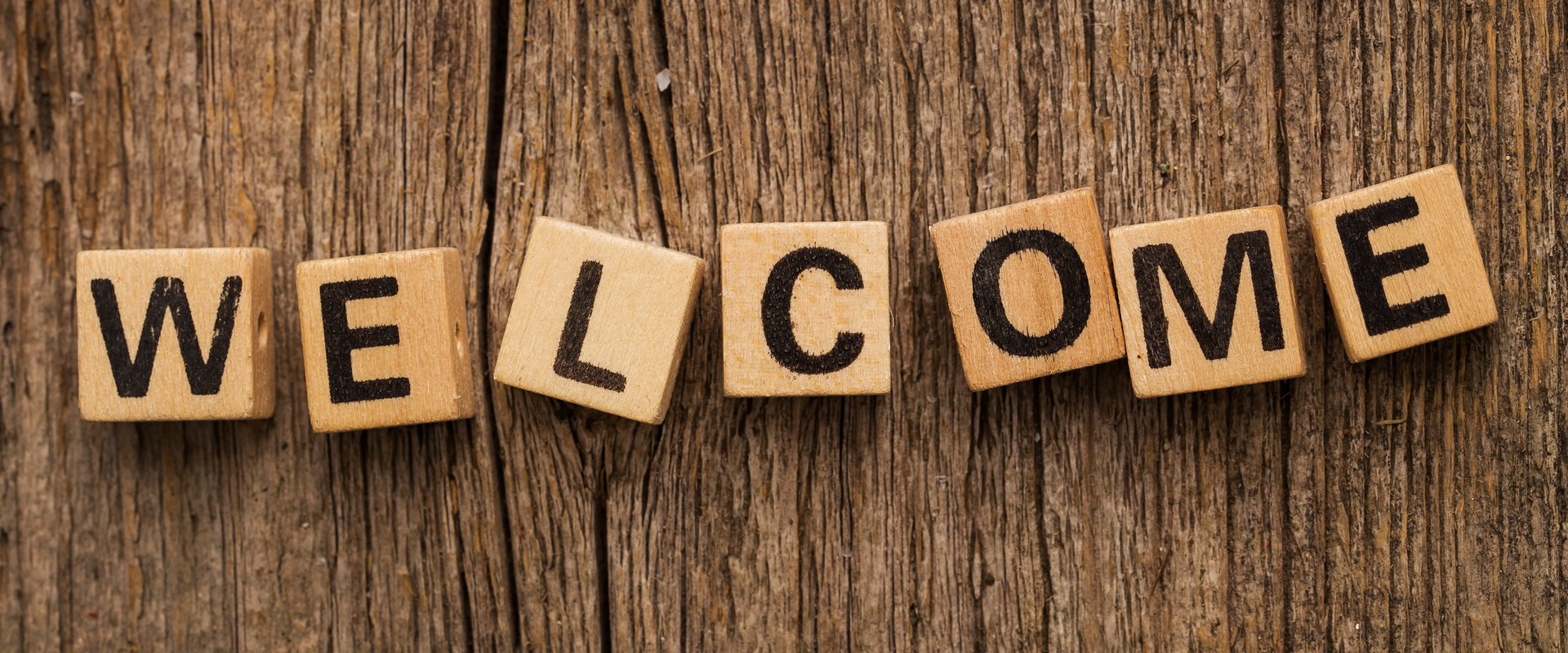 Welcome sign on wood