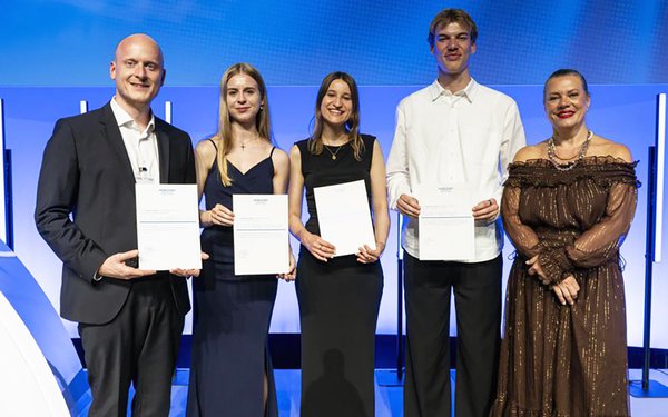 Five people, including Dr Maximilian Bruder, smile for the camera at the HORIZONT Foundation Award ceremony.